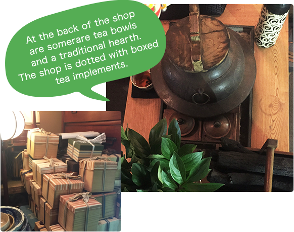 At the back of the shop are some rare tea bowls and a traditional hearth. The shop is dotted with boxed tea implements.